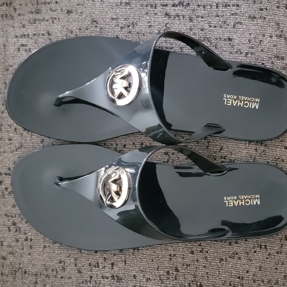 Michael Kors Glossy Black Lillie Flip Flops with Gold Emblem